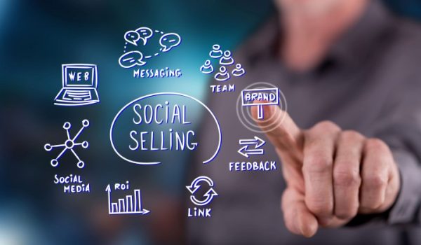Man touching a social selling concept on a touch screen with his finger