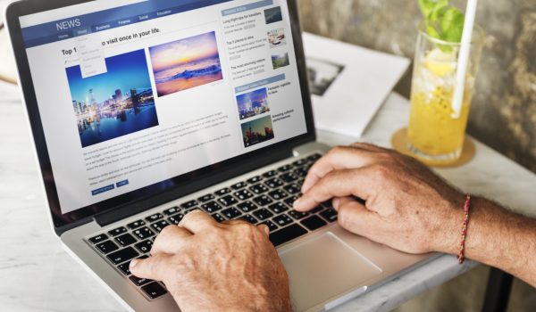 Elderly man is using computer laptop