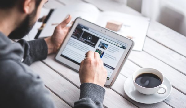 worker-reading-news-with-tablet
